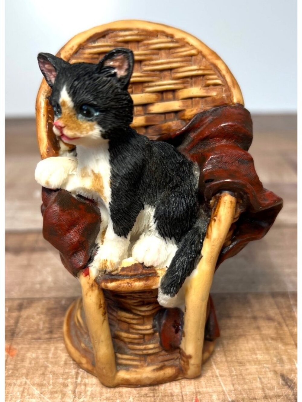 Cat Figurine In Wicker Chair With Blanket - Hand-Painted Resin